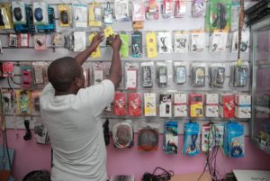 Cellphone shop in Tanzania. 5G technology requires access to 5G-compatible smartphones and devices. Photo credit: Riaz Jahanpour for USAID Tanzania / Digital Development Communications.